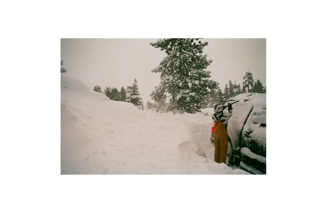 SQAWK rider uncovering snow from SQAWK truck