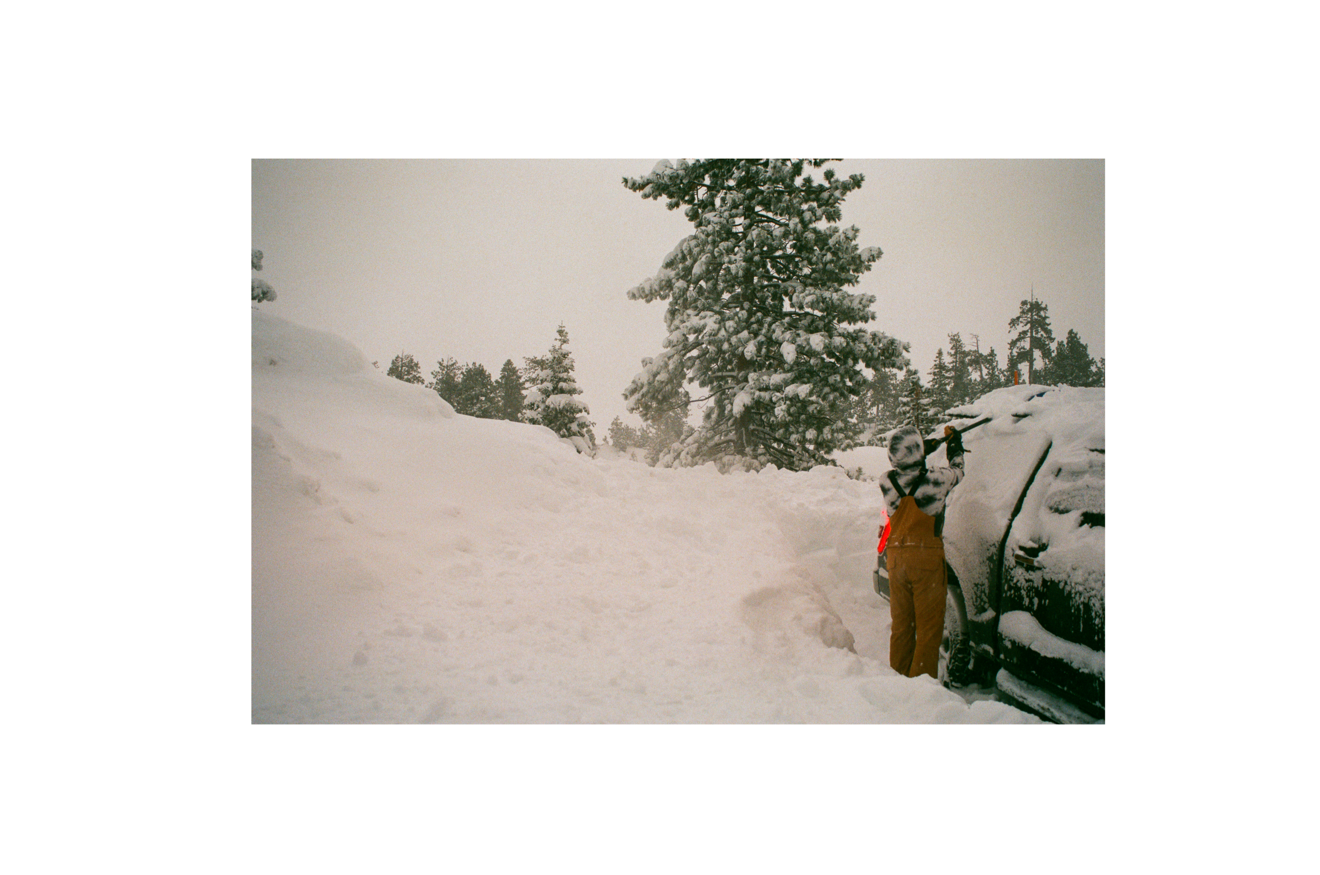 SQAWK rider uncovering snow from SQAWK truck